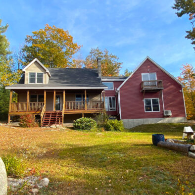 Fall foliage at Our Maine Getaway vacation home, enjoying the private backyard and mountain views