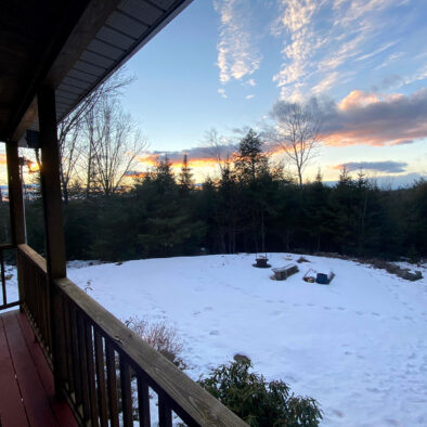 Sunset winter view from the back porch at Our Maine Getaway vacation rental home