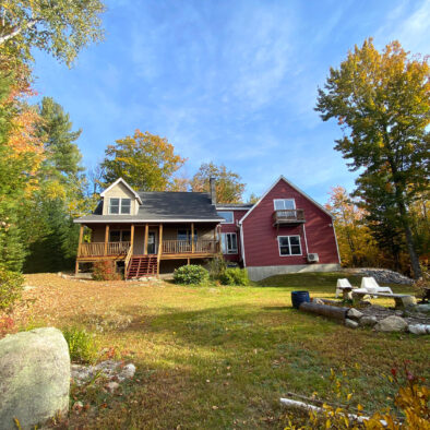 Fall foliage at Our Maine Getaway vacation home, enjoying the private backyard and mountain views